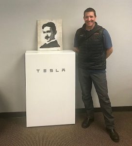 True South Solar owner Eric Hansen with a Tesla Powerwall