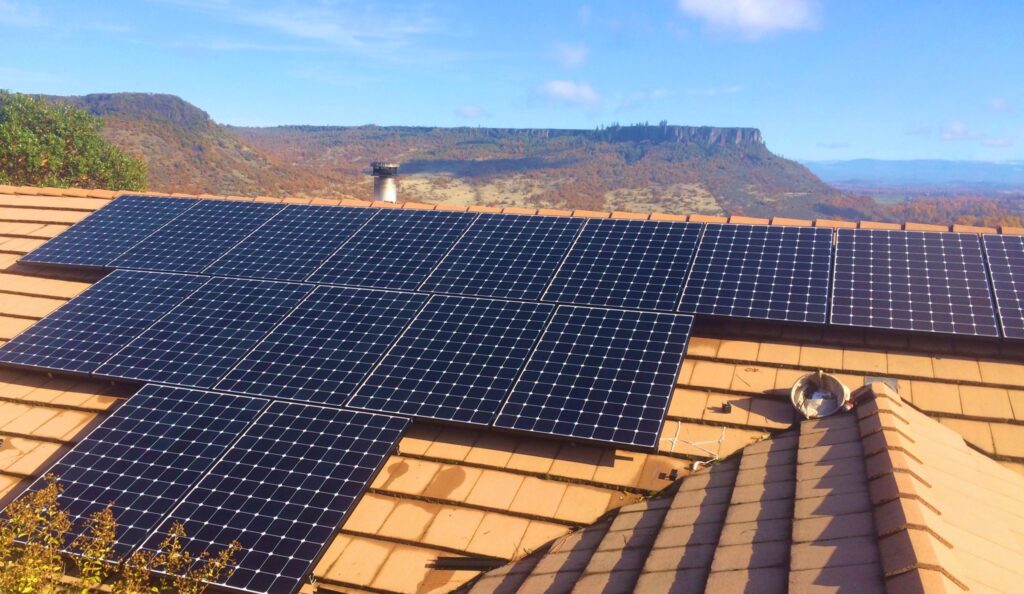 Solar Panels on a home in Central Point with Table Rock in the distance