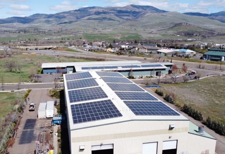 Commercial Solar Installation on Oak Tank and Steel with a view of Grizzly Peak