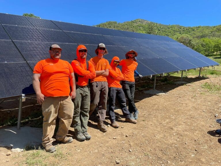 The True South Solar crew at a ground-mounted solar array installed in May 2024.
