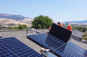 The True South Solar crew installs solar panels.